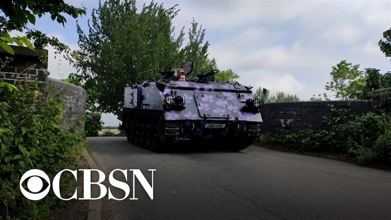 Tank taxi rumbles down streets of city in