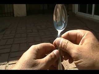 making fire using a spoon